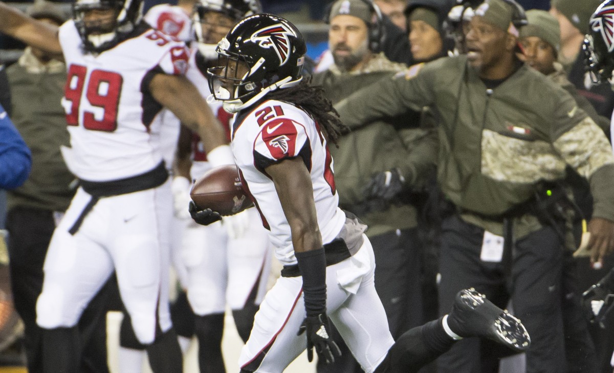 Atlanta Falcons cornerback Desmond Trufant (21) runs back an interception during the first half against the Atlanta Falcons at CenturyLink Field.